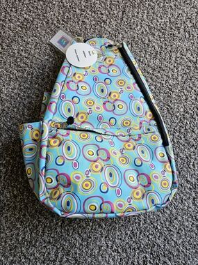 Jetpac Colorful Circle Print Sling Backpack - Turquoise, Yellow, Pink